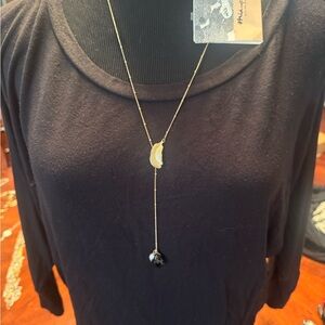 Elegant Gold and Black Necklace by [Brand]